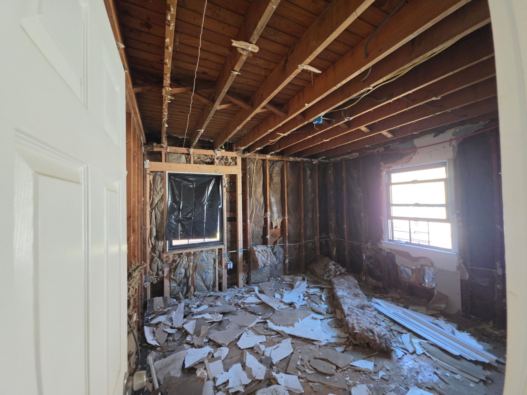 Bedroom gutted to the studs and ceiling joists, ready for the rebuild